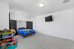 Bedroom with carpet flooring and baseboards