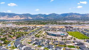 Aerial view of property's location featuring mountains and nearby suburban area