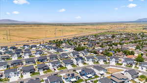 Aerial view of property's location with nearby suburban area and rural landscape