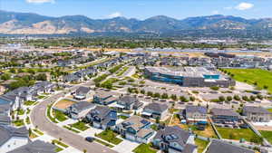 Aerial perspective of suburban area featuring a mountain backdrop
