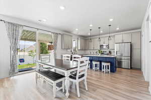 Dining area featuring recessed lighting and light wood-type flooring