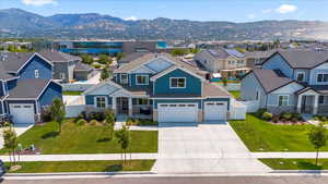 Aerial perspective of suburban area featuring a mountainous background
