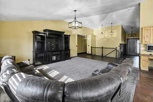 Living area featuring vaulted ceiling