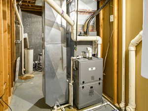 Utility room featuring heating unit