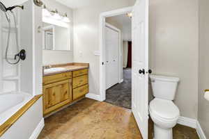 Full bath featuring vanity, bathtub / shower combination, and tile patterned floors