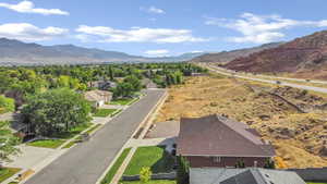 Aerial view of residential area featuring a mountainous background