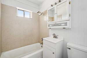 Full bathroom featuring shower / bathtub combination and vanity