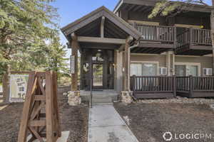 Entrance to property featuring a balcony