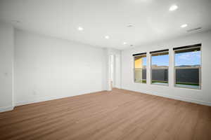 Spare room featuring recessed lighting and light wood-style flooring