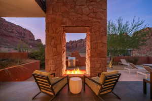 Patio terrace at dusk featuring a patio area and grilling area