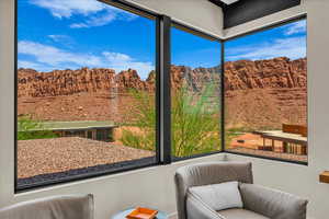 Sunroom / solarium featuring a mountain view