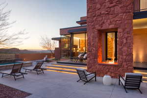Patio terrace at dusk featuring a patio