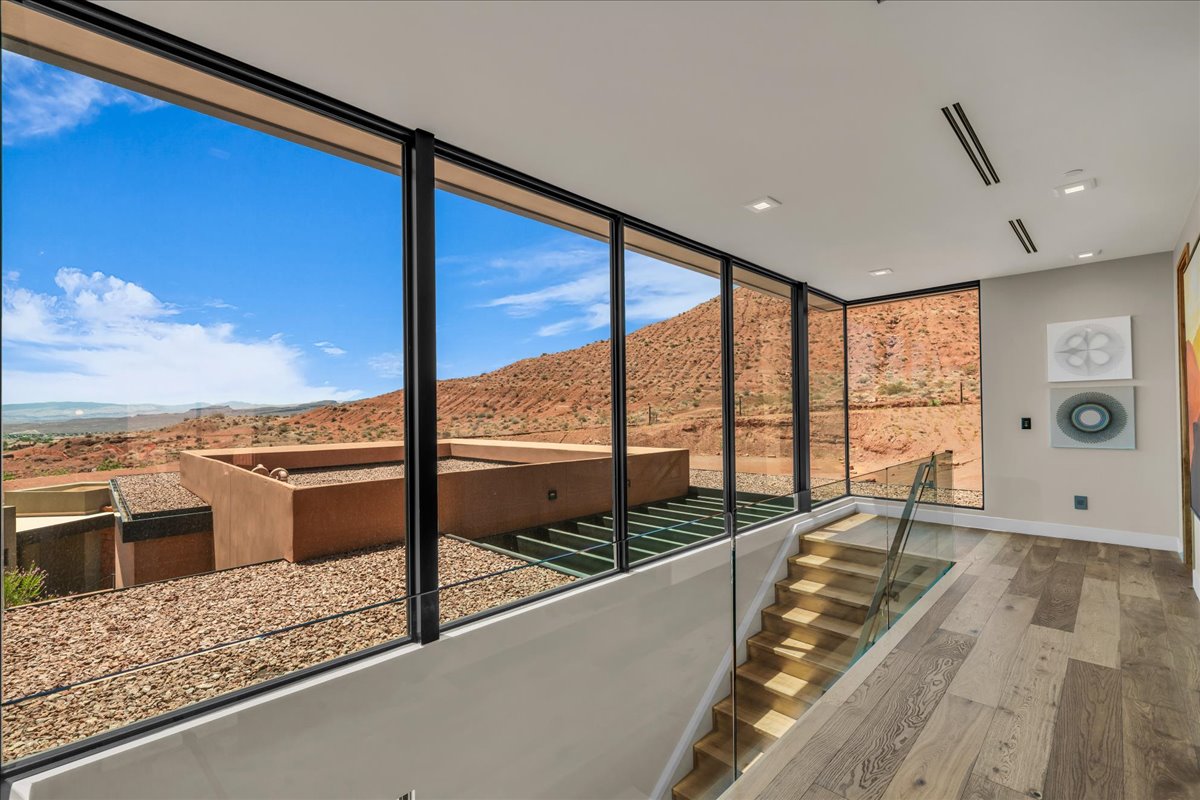 Unfurnished sunroom with a mountain view
