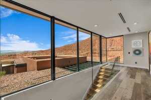 Unfurnished sunroom with a mountain view
