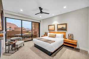 Bedroom with access to outside, recessed lighting, and a ceiling fan