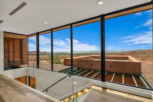 Unfurnished sunroom with a mountain view