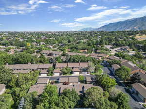 Aerial overview of property's location featuring a mountainous background