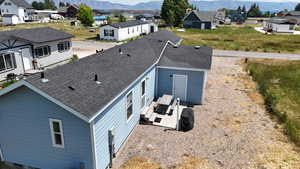 Aerial perspective of suburban area with a mountainous background