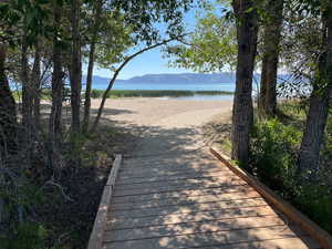 View of community with a water and mountain view