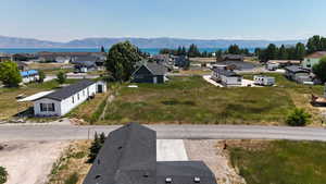 Aerial perspective of suburban area with a water and mountain view