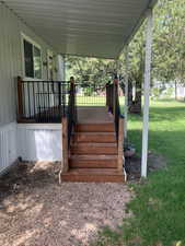 Deck featuring a lawn