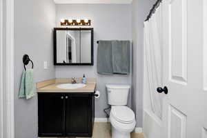 Full bathroom with vanity and shower / tub combo
