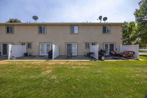 Back of house with french doors, stucco siding, and a patio