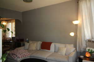 745-Living area with arched walkways and cooling unit