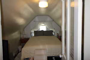 745-Bedroom featuring lofted ceiling