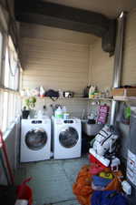 743-Washroom featuring separate washer and dryer and gas water heater