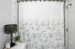 Full bath with a shower with curtain