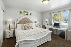 Bedroom with dark carpet