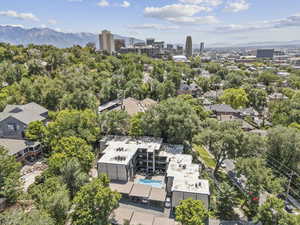 View of urban area with a mountain backdrop and a pool area