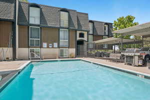 Community pool with a grill