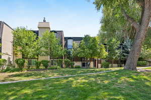 View of home's community featuring a lawn