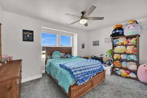 Bedroom with carpet and ceiling fan