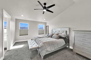 Bedroom with dark colored carpet, recessed lighting, ceiling fan, and vaulted ceiling