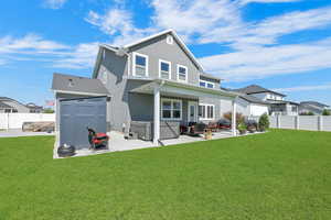 Rear view of property featuring a patio area, a fenced backyard, stucco siding, and a storage shed
