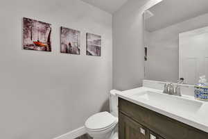 Bathroom featuring vanity and toilet
