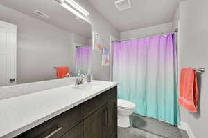 Full bathroom featuring vanity and a shower with shower curtain