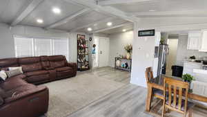 Living area featuring light wood-style flooring and recessed lighting