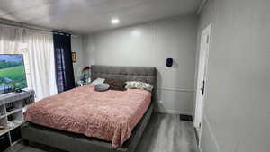 Bedroom with wood finished floors