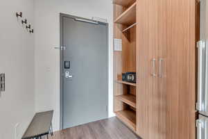 Walk in closet featuring wood finished floors