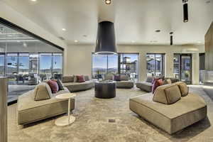 Carpeted living room featuring recessed lighting