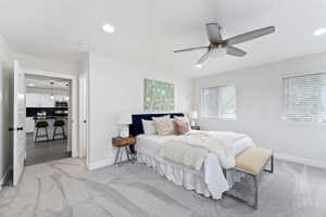 Bedroom with recessed lighting, light colored carpet, and ceiling fan