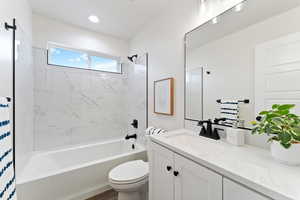 Full bathroom featuring vanity and tub / shower combination