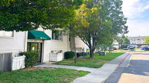 A building entrance from parking and pool side