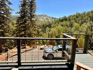 Balcony featuring a view of trees