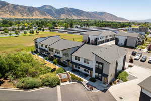 Aerial perspective of suburban area with a mountainous background