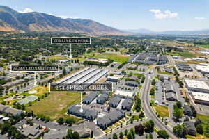 Aerial perspective of suburban area with a mountainous background
